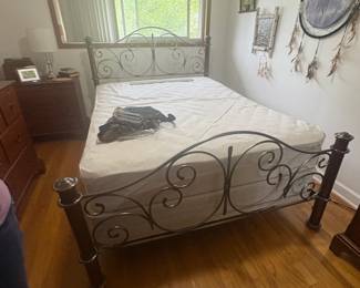. . . queen wrought-iron bed