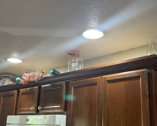 Antique scale, glass, insulators, and milk jugs
