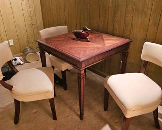 small table with four chairs, sold separately 