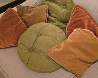 a colorful bunch of vintage pillows 