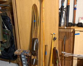 Wood kayak paddle , wood canoe paddle, wood water ski, vintage croquet set (display only), vintage tools, wood crossbows (display only?)