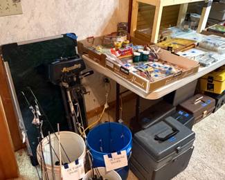 Ice fishing poles, Coleman folding camp table, Aqua Bug trolling motor, fishing gear
