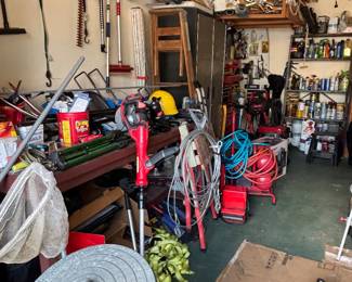 Multiple tools and equipment thruout garage