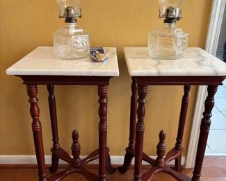 Vintage ‘70s side tables with marble square top and wooden base legs. Also shown, two vintage glass lamplights 