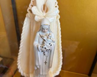 Carved devotional decorative ornate candle with religious figurine in glass case 