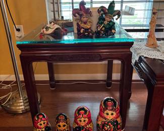 Beautiful mahogany side table with glass top. Brass and glass lamp   Russian dolls in various sets 