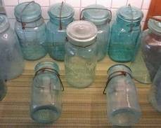 Blue Glass topped mason jars some are not the usual Ball or Atlas brands
