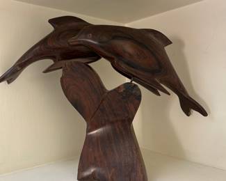 Carved wood dolphins