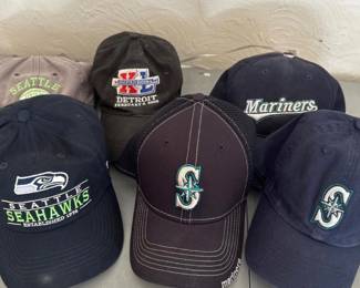 Mariners and Seahawks hats