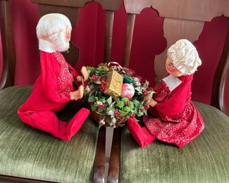 1971 vintage Annalee Mobilitee Christmas doll set featuring Mr. and Mrs. Santa Claus sitting and holding a filled wicker basket