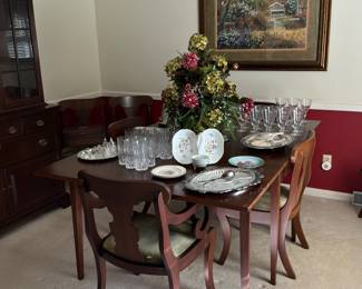 Gorgeous gate leg drop leaf dining table with 8 chairs. 2 are captains chairs 