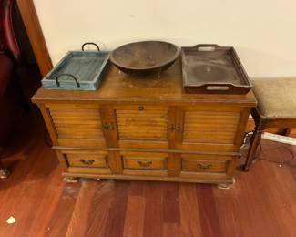 Trunk with trays amd wooden bowl atop