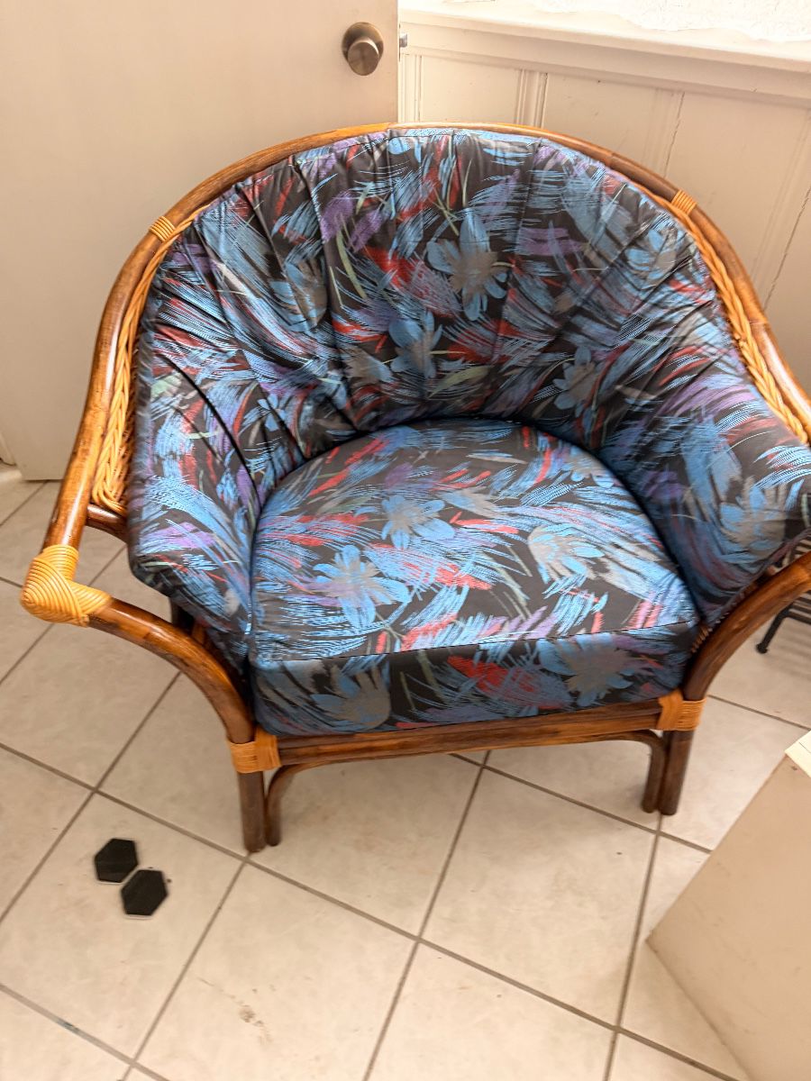 Rattan barrel armchair with custom tropical print cushion