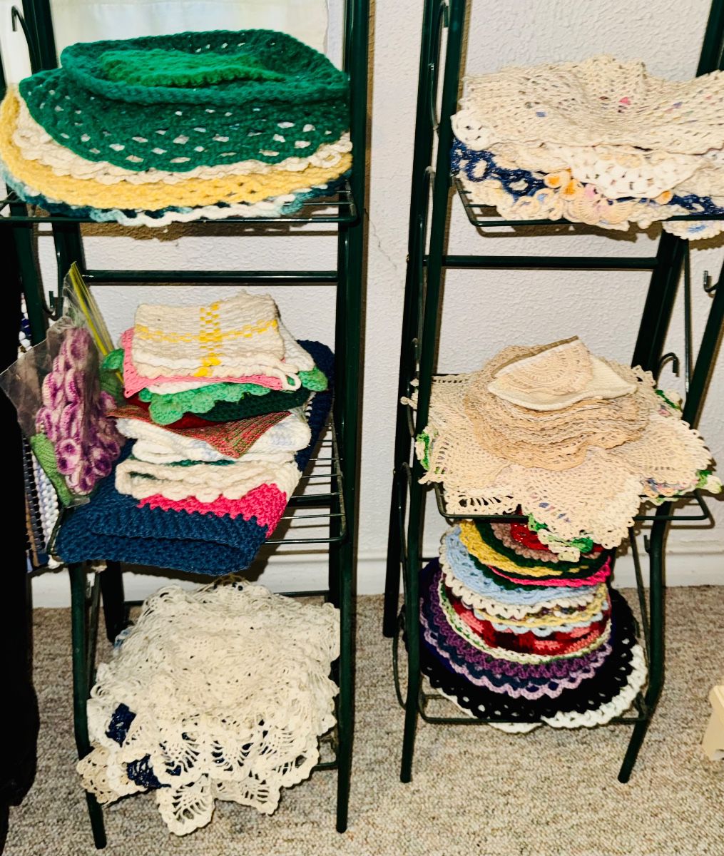 Shelves of handmade crocheted doilies and linens