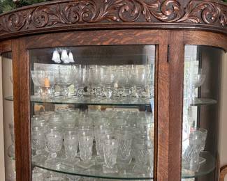 The other MAGNIGFICENT carved china cabinet w/ lots of old stemware