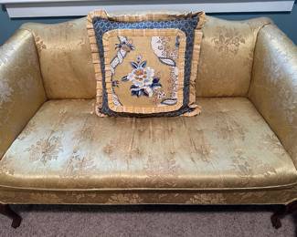 Quaint loveseat in luxurious gold fabric
