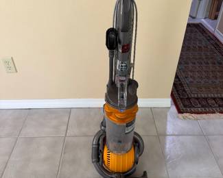 #100 - $100 - Dyson DC 25 vacuum cleaner - orange