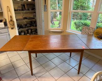 #66 - $350 - Danish table with built in leaf size 51"Lx33Wx29T