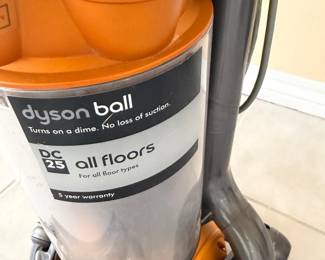 #100 - $100 - Dyson DC 25 vacuum cleaner - orange