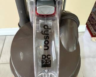 #100 - $100 - Dyson DC 25 vacuum cleaner - orange