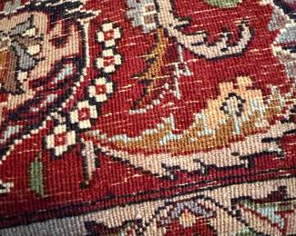 #83 - $ - Cream and red area carpet