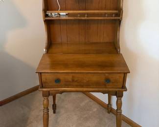 Charming vintage wooden secretary/writing desk with attached hutch, featuring a beautiful traditional design and turned legs