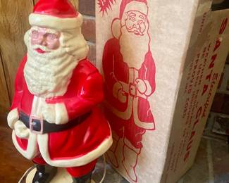 Small vintage blow mold Santa with box. Approximately 19” tall 