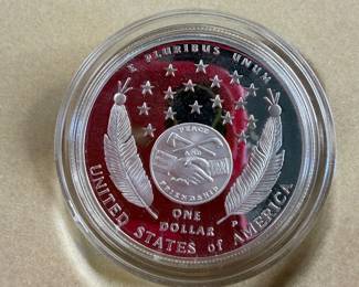 Lewis and Clark silver dollar with native American handicraft work