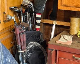 Old golf clubs and set of lady’s Ping irons