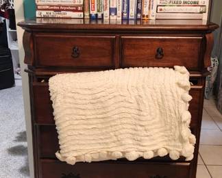 dresser, books, chenille bedspread