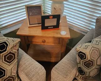 End table, lamp, decorative frames
