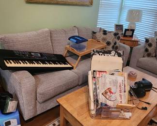 Rattan Magazine holder, Yamaha Keyboard, Love seat, coffee table, ephemera