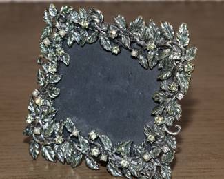 Enameled picture frame-There are several available throughout the home and several by Jay Strongwater as well