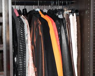Virtually every item in this closet is designer brand-Chanel, Escada, Alexander McQueen, Christian Louboutin, and so many more.  From handbags to clothing to scarves to shoes, we have it all!