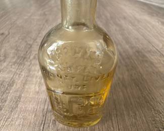 vintage reproduction of a Frank's Safe Kidney & Liver Cure glass bottle