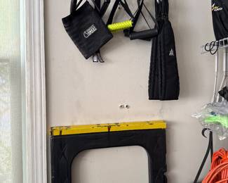 wall-mounted fitness accessory rack with workout straps