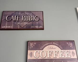 two vintage-style coffee signs
