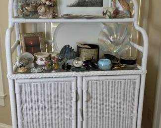 White Wicker Cabinet with Framed Art and Home Accents