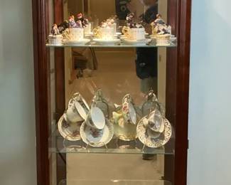 Lighted Curio Cabinet with Teacups and Saucers