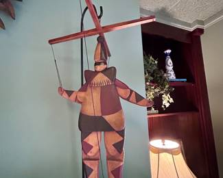 Wooden jester marionette with a crossbar and strings