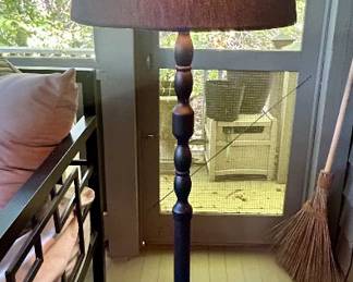 Traditional turned-wood floor lamp with dark brown drum shade