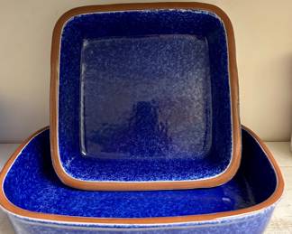 Blue glazed stoneware baking dishes with terracotta rims