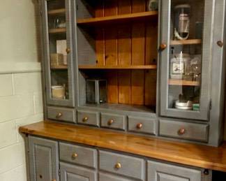 Two-piece gray hutch with glass-front cabinets
