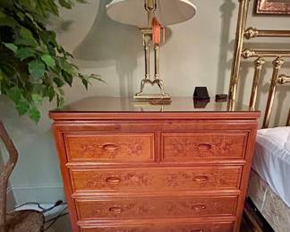 Asian-style carved five-drawer chest with bird-and-blossom detailing