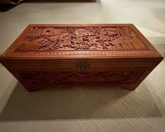 Heavily carved Asian-style cedar storage chest with interior tray, lock and key