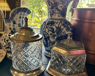 Two cut-glass lidded jars decorative metal trim • blue-and-white ceramic vases