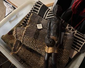 a dozen or so brand new rugs with the tags on them