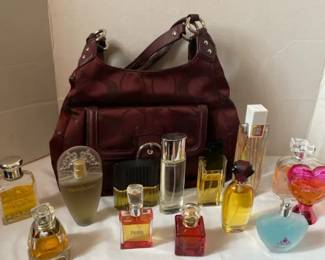 Assorted Womens Fragrances And A Coach Bag With Matching Wallet