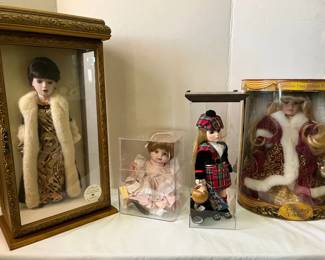 Four Delightful Encased Dolls