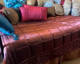 Metal Daybed On Risers And Bedding